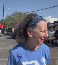 A woman wearing blue blockprinted headband